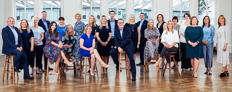 Photo of MB Investment Group team celebrating.